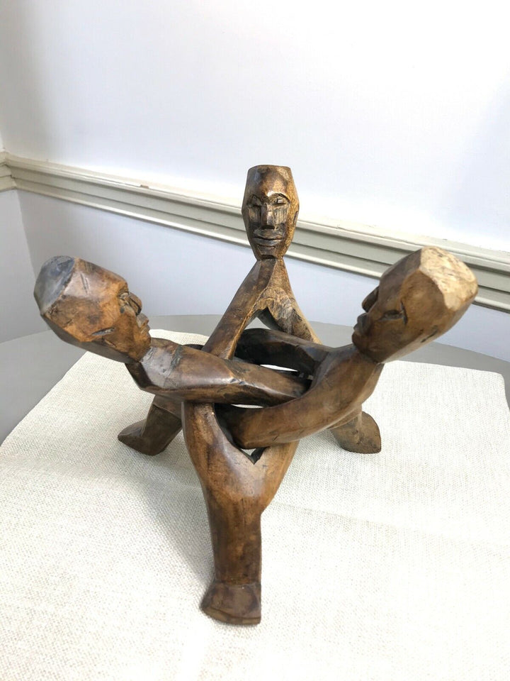 HAND CARVED WOODEN INTERLOCKING TRIO OF TRIBAL MEN